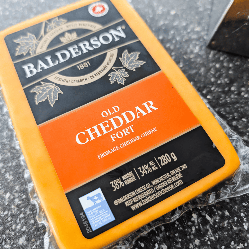 Old Cheddar cheese for ham and asparagus quiche recipe.