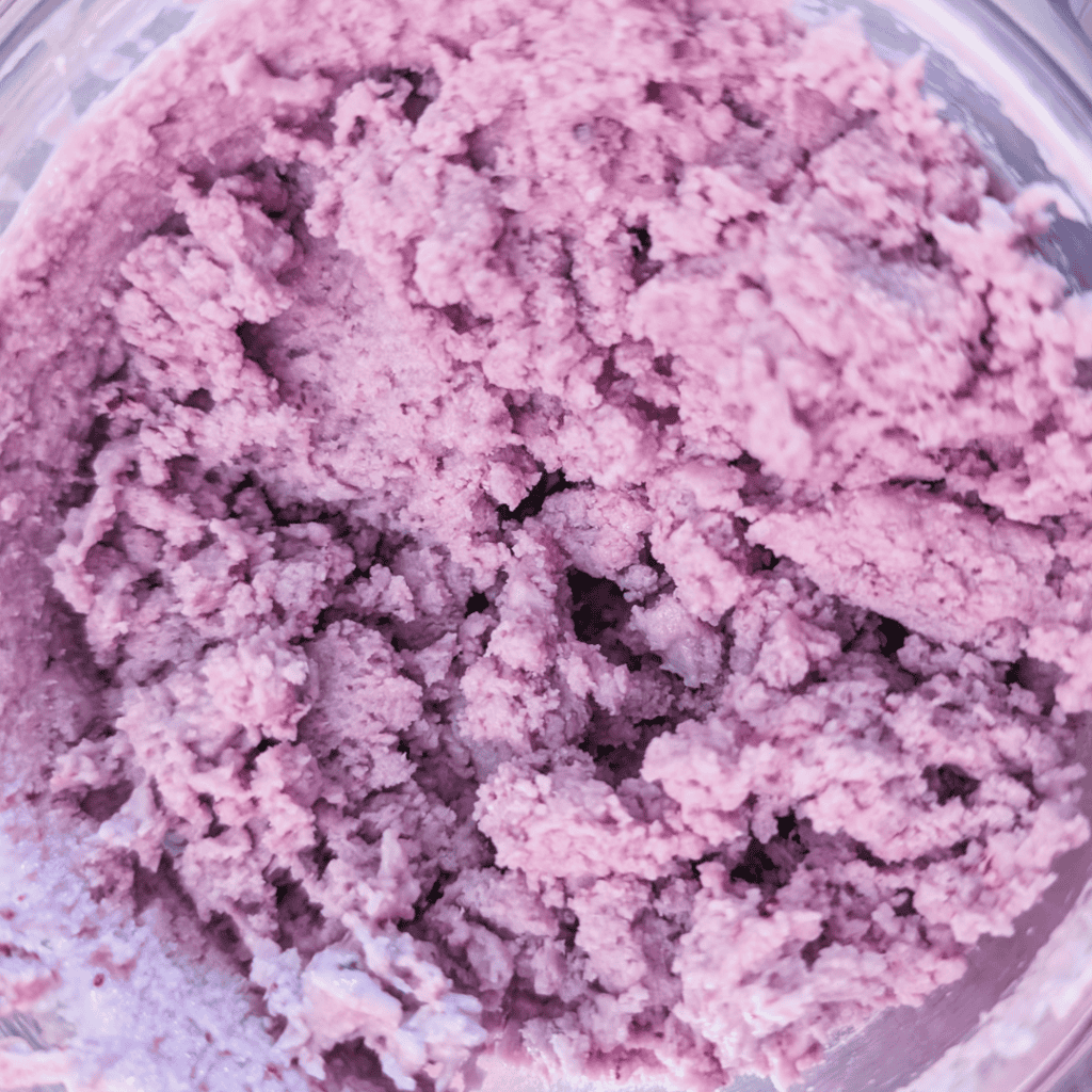 Creamy blueberry ice cream with a rich blueberry reduction swirl.