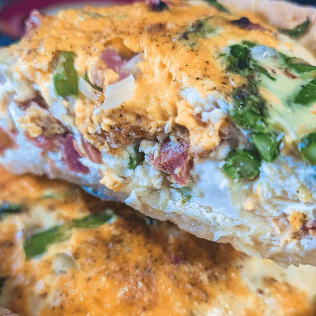 Delicious ham and asparagus quiche, perfect for family meals and brunch gatherings.