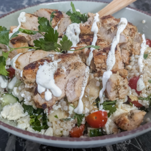 Healthy chicken couscous salad with fresh vegetables and creamy Greek yogurt dressing.