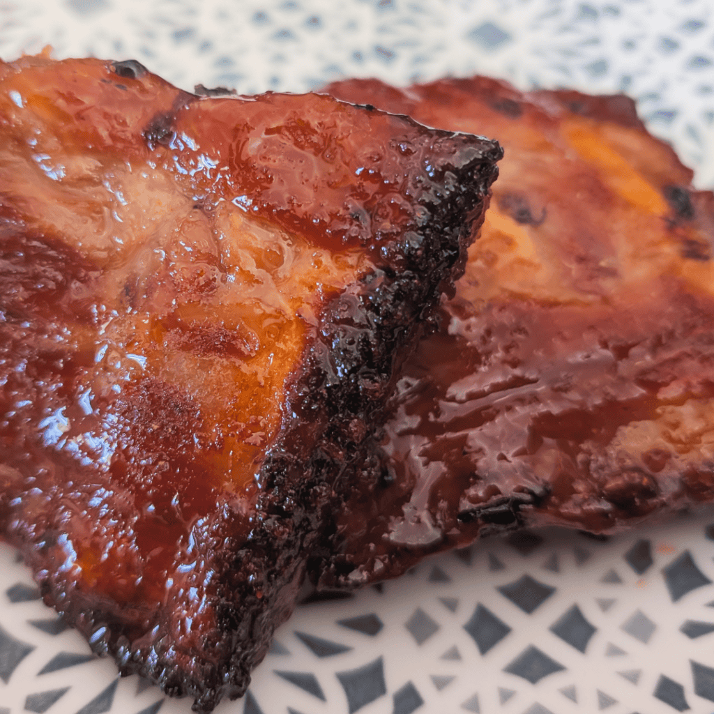 Delicious oven-cooked ribs with sticky maple glaze, perfect for a flavorful and tender meal. Ideal f.