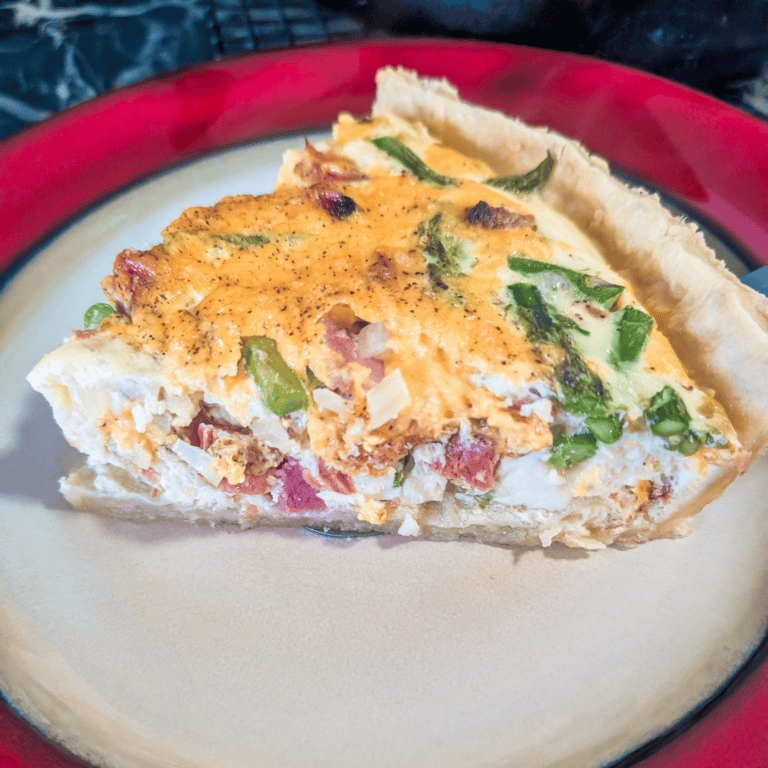 Delicious ham and asparagus quiche perfect for family meals and gatherings. Easy to prepare with fre.