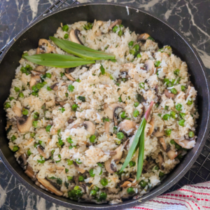 Delicious mushroom rice pilaf featuring ramps and peas, perfect for a flavorful vegetarian meal or s.