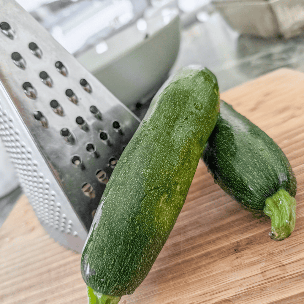 Zucchinis, fresh vegetables, healthy cooking ingredients, kitchen prep.