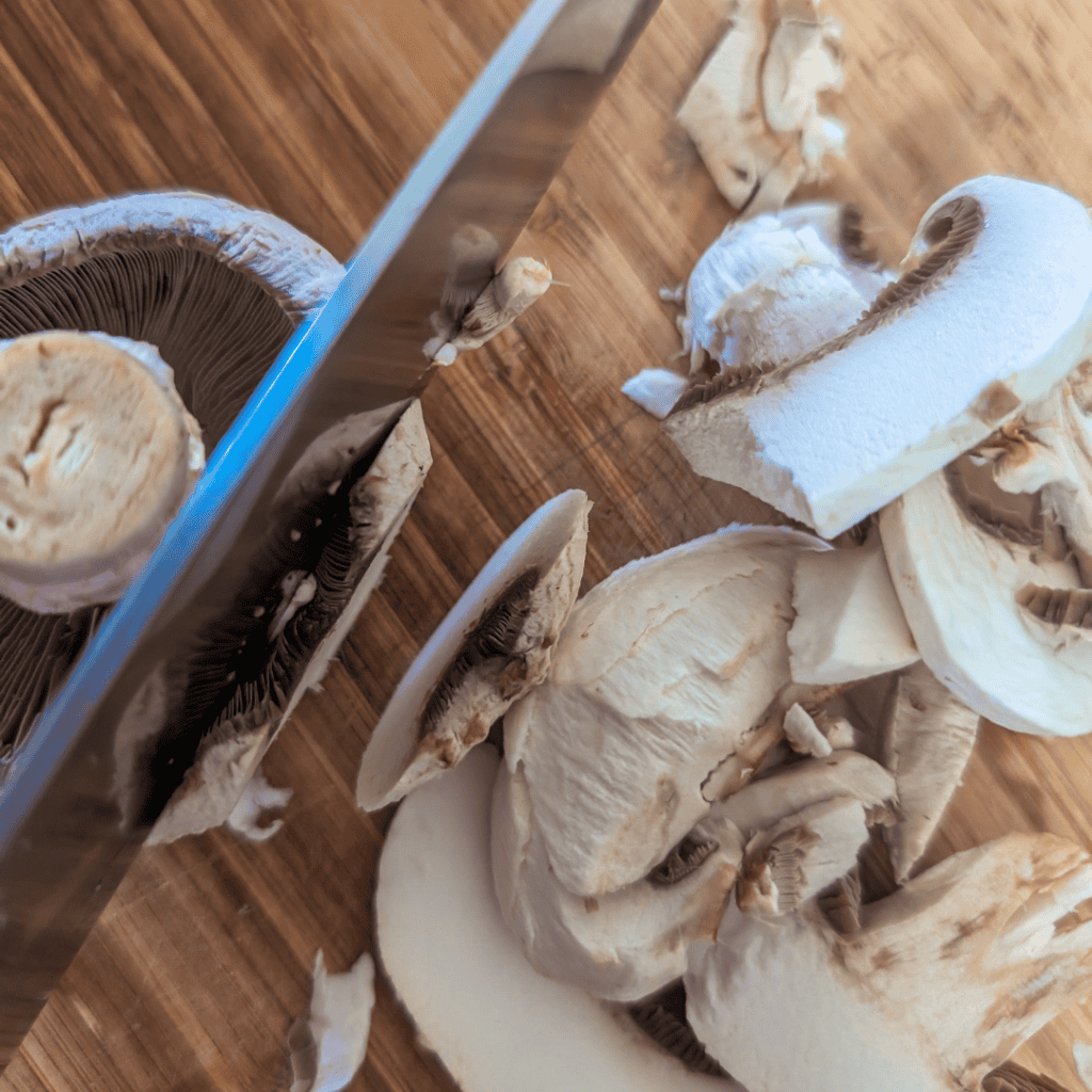 Sliced mushrooms ready for cooking in a mushroom rice pilaf recipe.