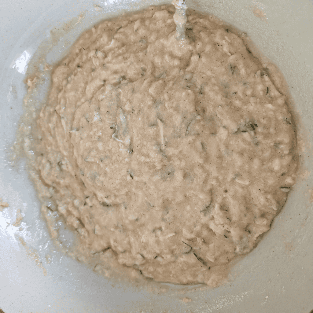 Fresh homemade cookie dough mixture in a bowl, ready for baking.