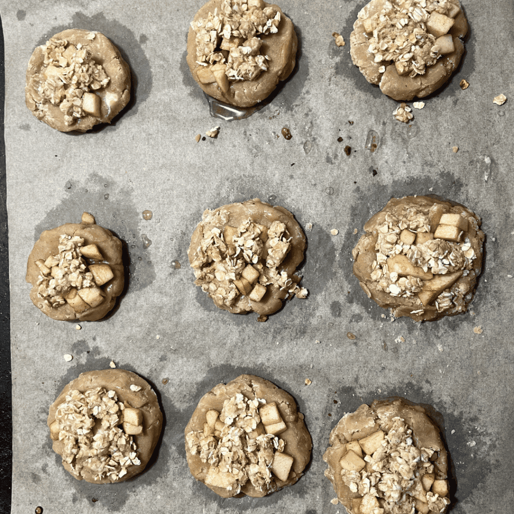 adding the oat topping to the apple cookie base
