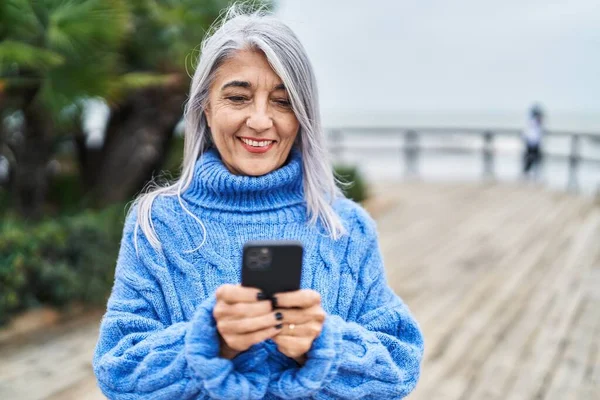 Smiling lady looking at counselling packages