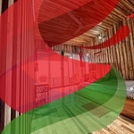 Comfortable wooden bedroom in Chondrika - Room B1 with balcony, warm decor, and natural lighting.