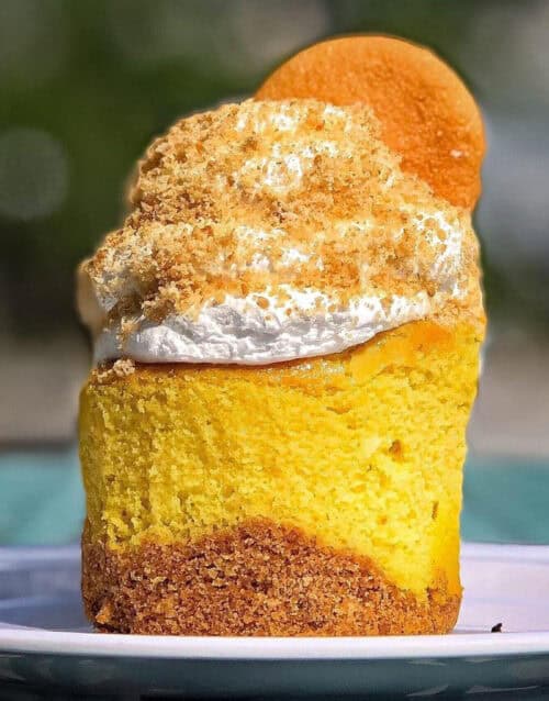 Delicious banana pudding cheesecake with crumb topping and whipped cream.