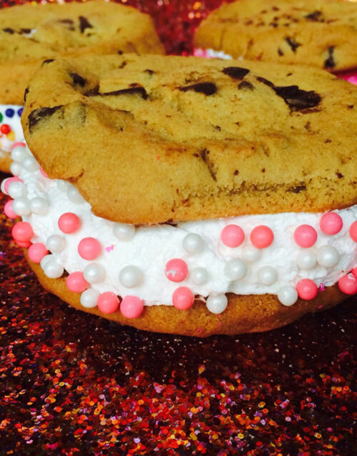 Cheesecake sandwich with cookies and sprinkles, perfect for dessert.