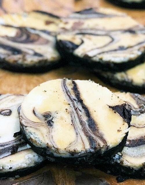 Delicious marble cheesecake brownie slices with creamy and chocolate swirls.