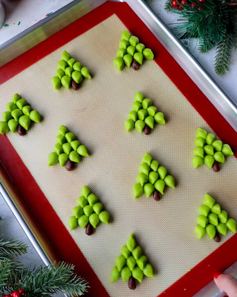 image of christmas tree cookies that have been shaped and are ready to be baked