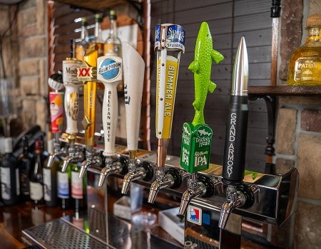 Beer tap handles featuring various brands and fun designs at Casa Tequila Mexican Grill & Cantina in.