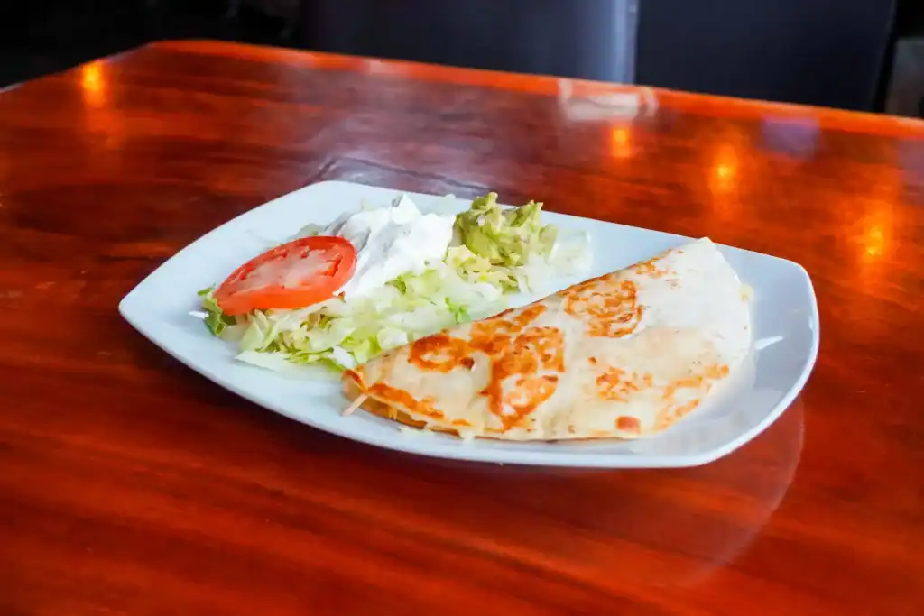Delicious quesadilla served with fresh lettuce and tomato salad at Casa Tequila Mexican Grill & Cant.