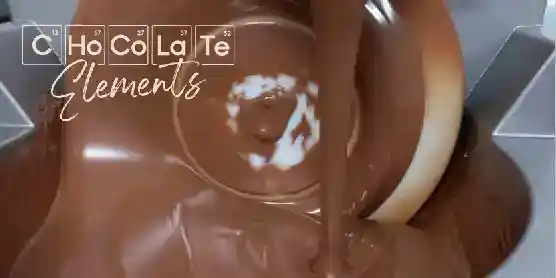 A stream of melted chocolate pours into a swirling pool, with Chocolate Elements written at the top left in a periodic table style font.