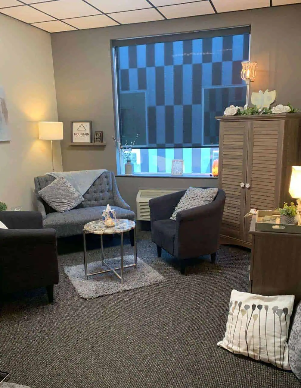 Cozy modern office lounge with stylish chairs, soft lighting, and decor for a professional Bitcoin investment company Focus on comfort and professional ambiance at Chrysalis BTC office.