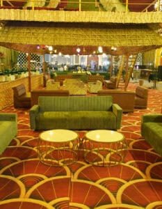 Event hall interior with stylish seating and vibrant decor.