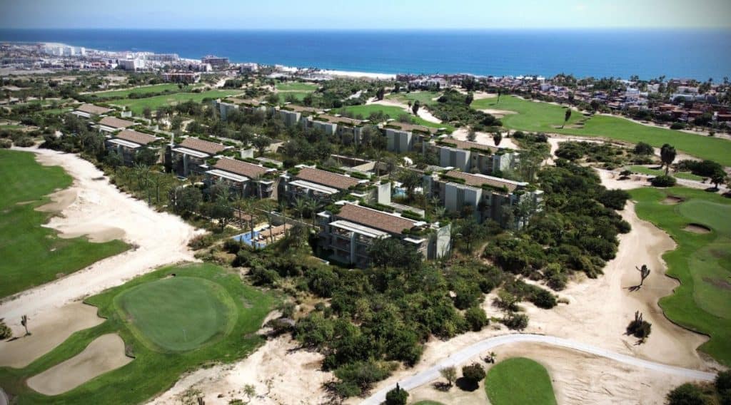 Aerial View Of Luxury Condos Surrounded By Golf Course Greens And Ocean Views In Club Campestre Real Estate, San José Del Cabo.