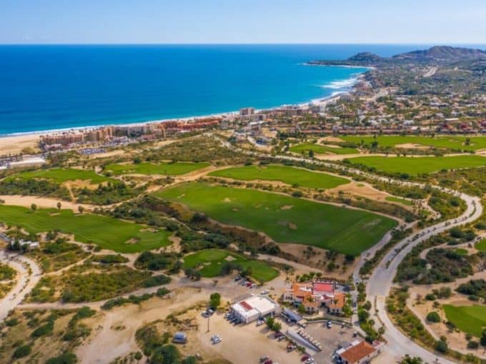 Panoramic Aerial Shot Of The Club Campestre Golf Course With The Sea Of Cortez In The Background Near San José Del Cabo.