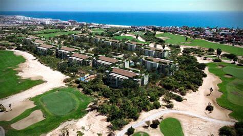 Stunning Aerial View Of Club Campestre With Lush Golf Courses, Ocean Horizon, And Modern Residences Nestled Among Greenery. Perfect For Luxury Golf And Ocean View Real Estate.