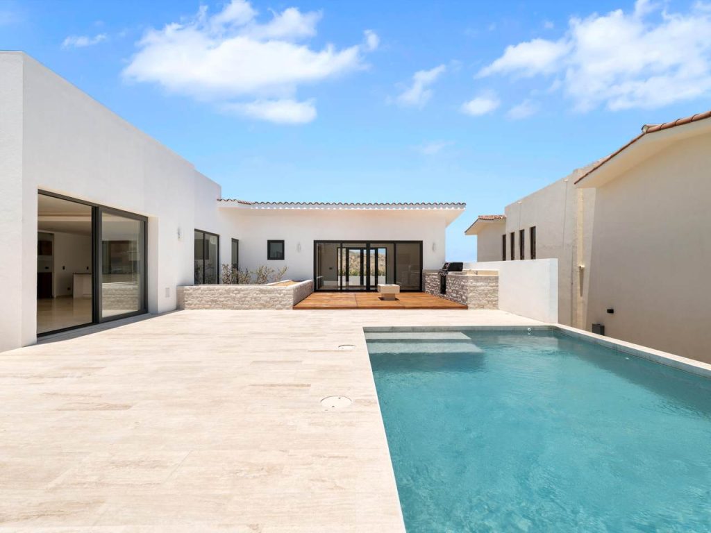 Experience A Modern Outdoor Terrace With A Heated Swimming Pool At 12 Los Valles In Club Campestre San José Del Cabo, Where Natural Stone Accents, Warm Wood Decking, And A Seamless Indoor–Outdoor Flow Create The Perfect Setting For Baja’s Bright, Sun-Filled Days. Designed For Both Relaxation And Entertainment, This Stylish Space Reflects The Effortless Coastal Luxury That Defines Life In Club Campestre.