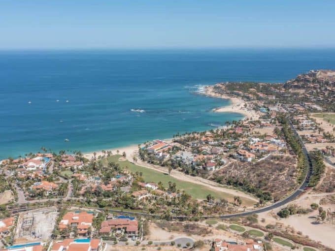 Stunning Aerial View Of Club Campestre With Ocean And Golf Course Views, Showcasing Luxurious Homes, Lush Greenery, And Pristine Beaches, Ideal For Real Estate And Golf Enthusiasts.