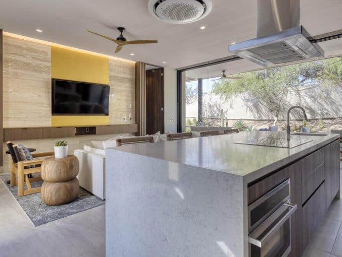 Luxurious Modern Kitchen With Ocean Views, Open Floor Plan, And Contemporary Decor At Club Campestre Real Estate. Perfect For Golf Enthusiasts Seeking Upscale Living By The Sea.