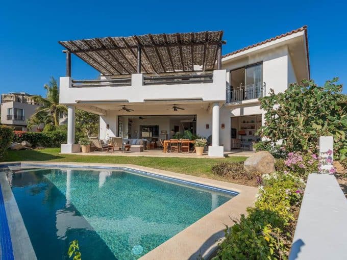 Elegant Villa With Private Pool, Lush Landscaping, And Ocean Views At Club Campestre'S Golf Community, Offering Luxury Living Near Pristine Beaches.