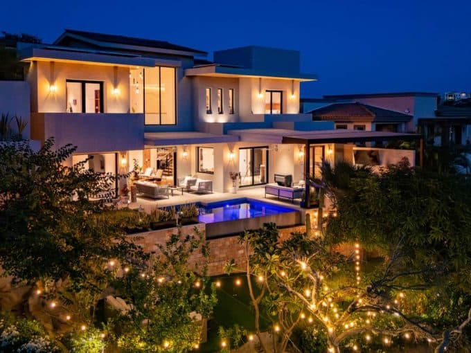Luxury Villa At Club Campestre With Ocean View And Modern Design, Illuminated At Night.