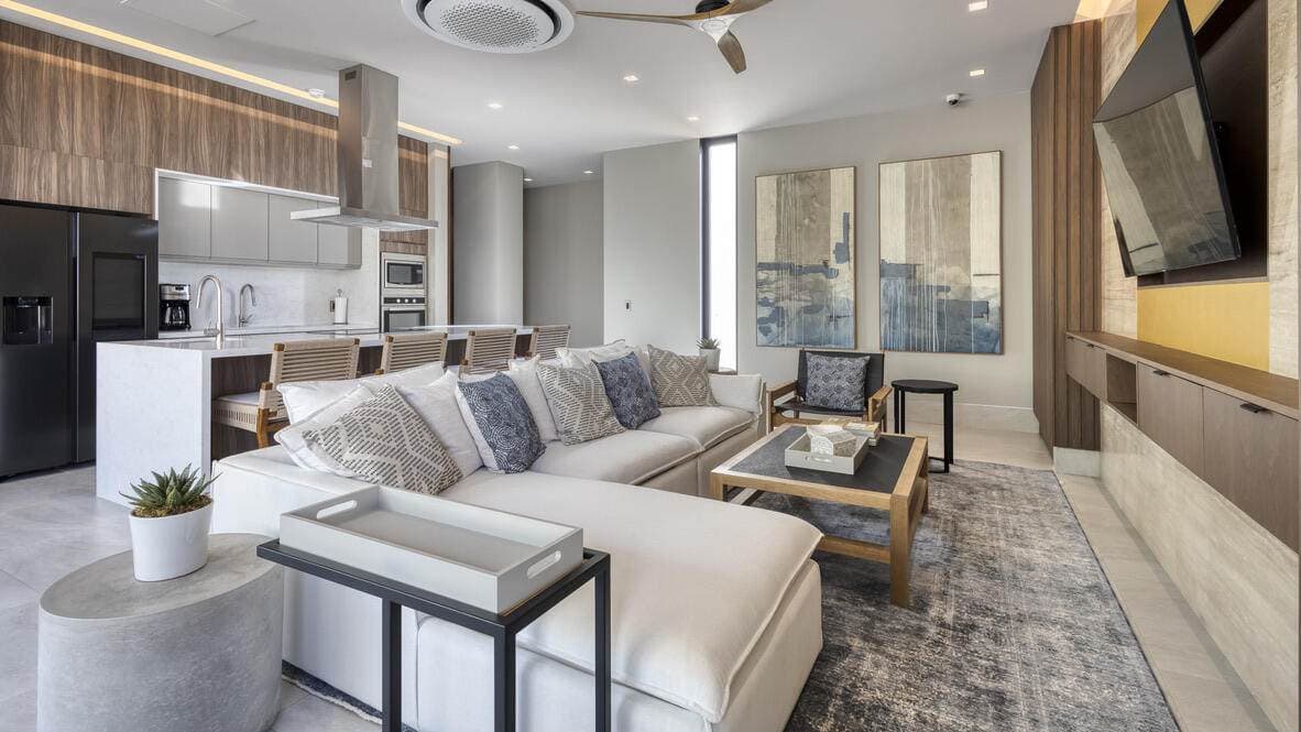 Modern Living Room With Ocean View, Golf Course Scenery, And Stylish Decor At Club Campestre.