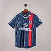 Camisa de fútbol del PSG en color azul con franjas rojas, logo de Opel y diseño de alta calidad.