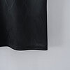 Elegante diseño de tela negra con patrón sutil, estilo moderno y sofisticado para tendencias de moda.