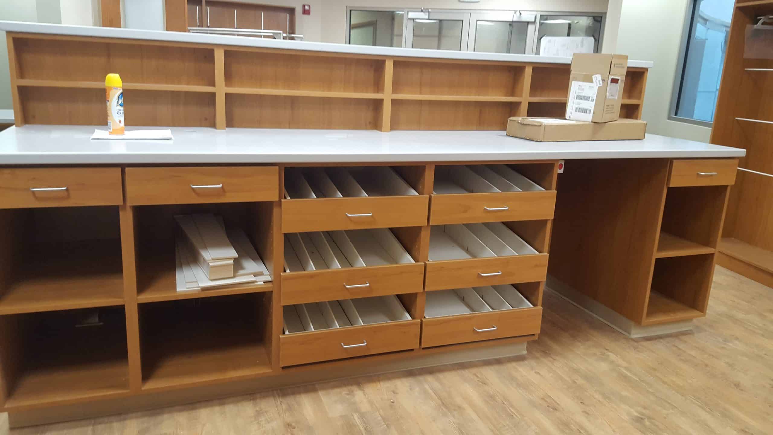 Custom wooden storage cabinets and drawers for closet organization in Durango.