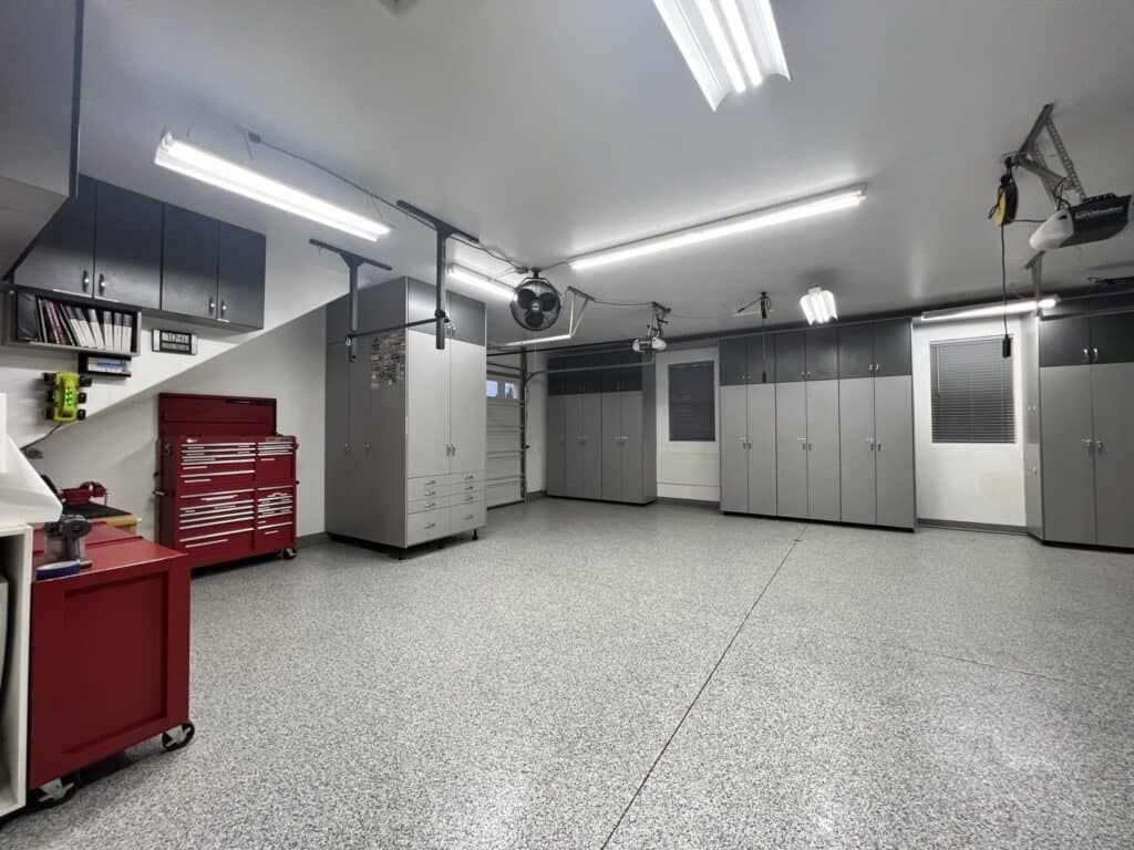 Spacious garage with custom cabinets and storage solutions in Durango.