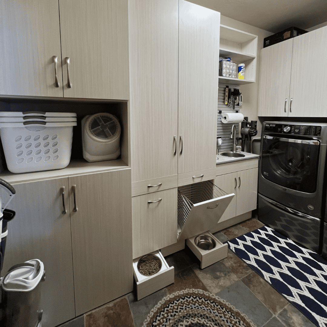Organized laundry room with cabinets, washer, and dryer in Durango, Colorado.