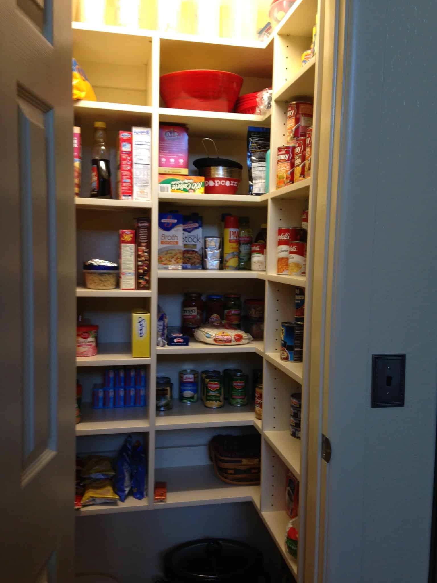 Organized pantry with shelves filled with food and storage containers in Durango.