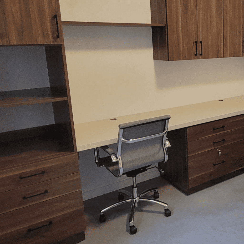 Custom office workspace with wooden cabinets and a desk in Durango, Colorado.