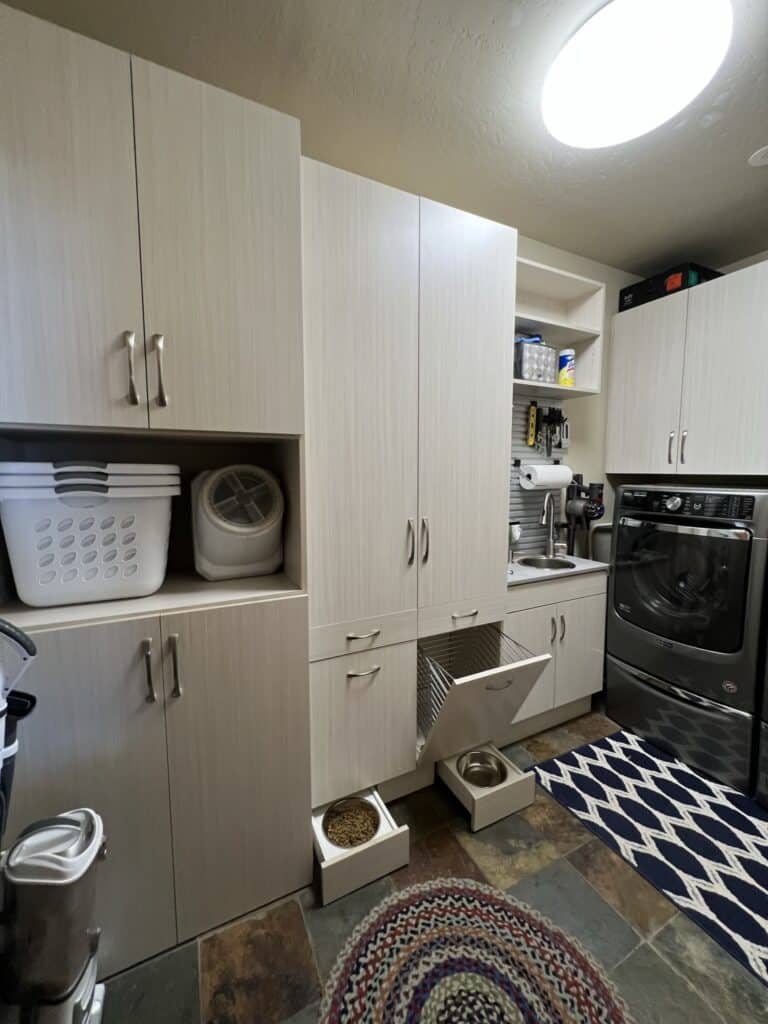 Modern laundry room with custom cabinets and storage in Durango.