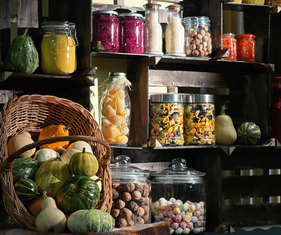 Colorful jars and fresh produce on rustic shelves in a cozy kitchen.