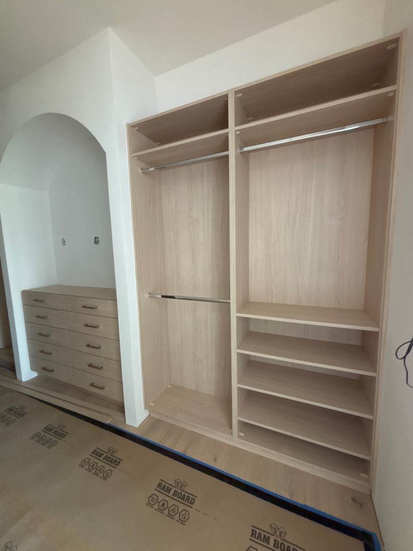 Custom closet with shelves and hanging space in Durango home.
