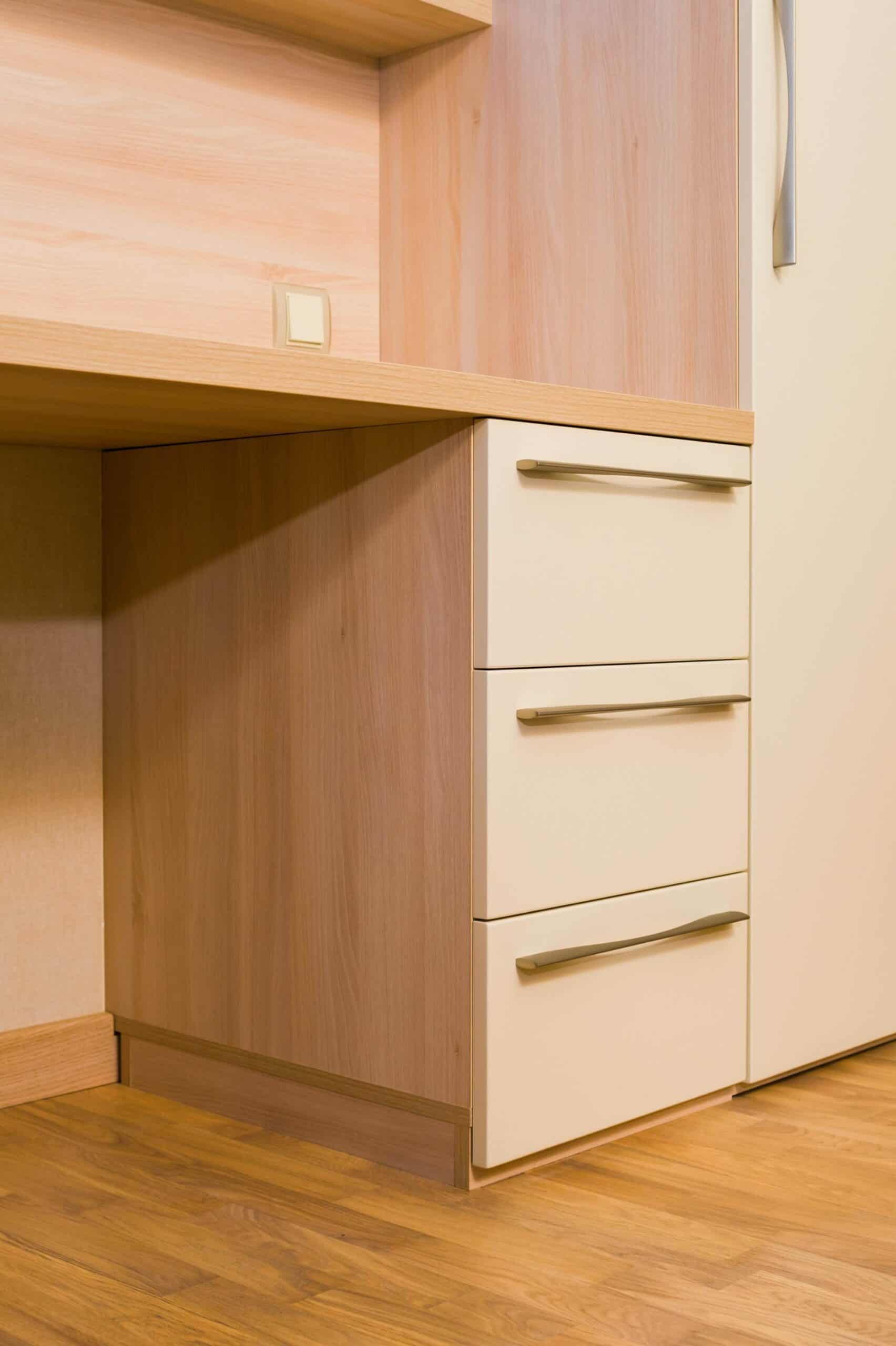 Modern custom closet with drawers and wood finish in Durango home.