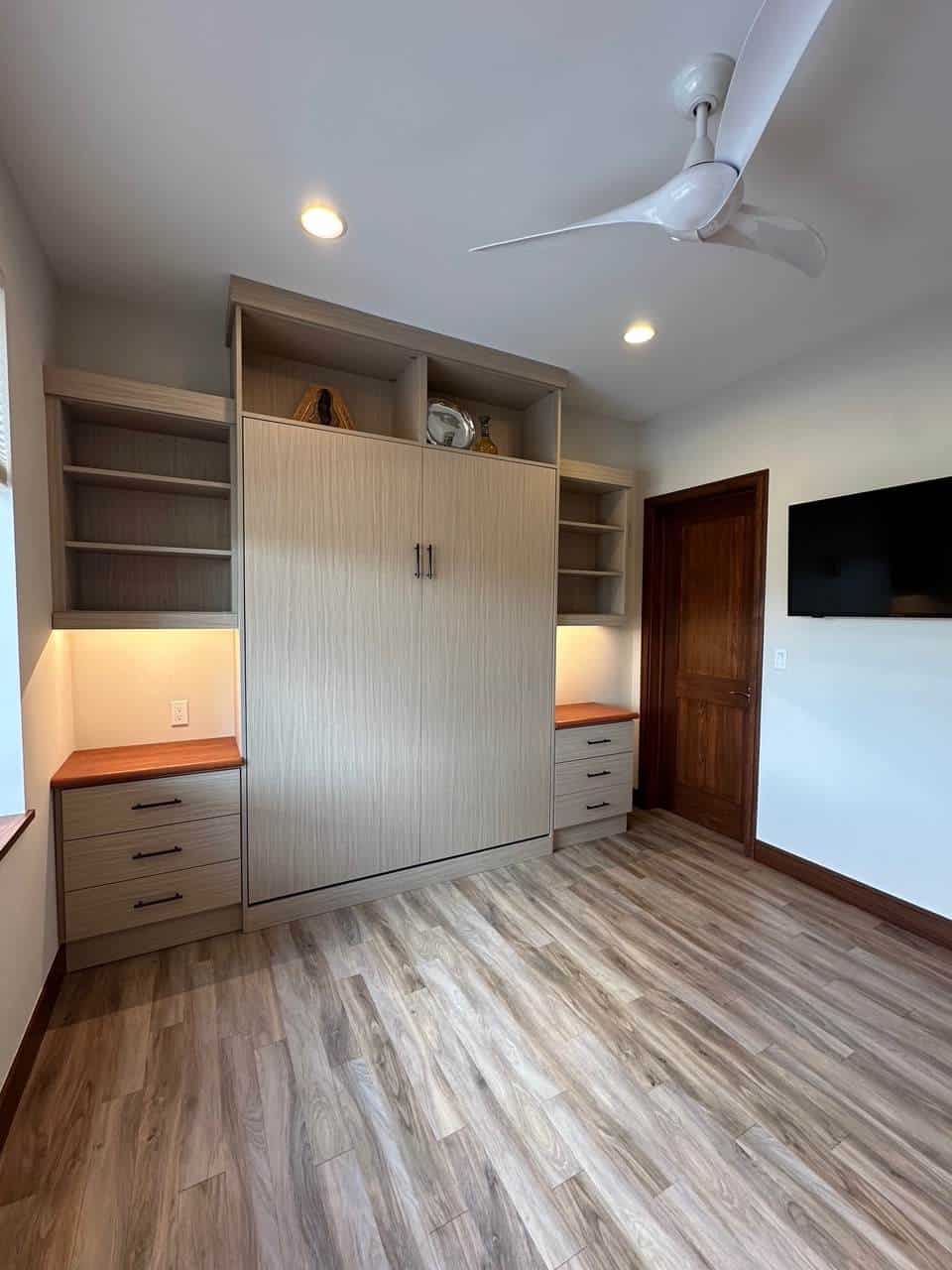 Modern custom closet with ample storage and open shelving in Durango home.