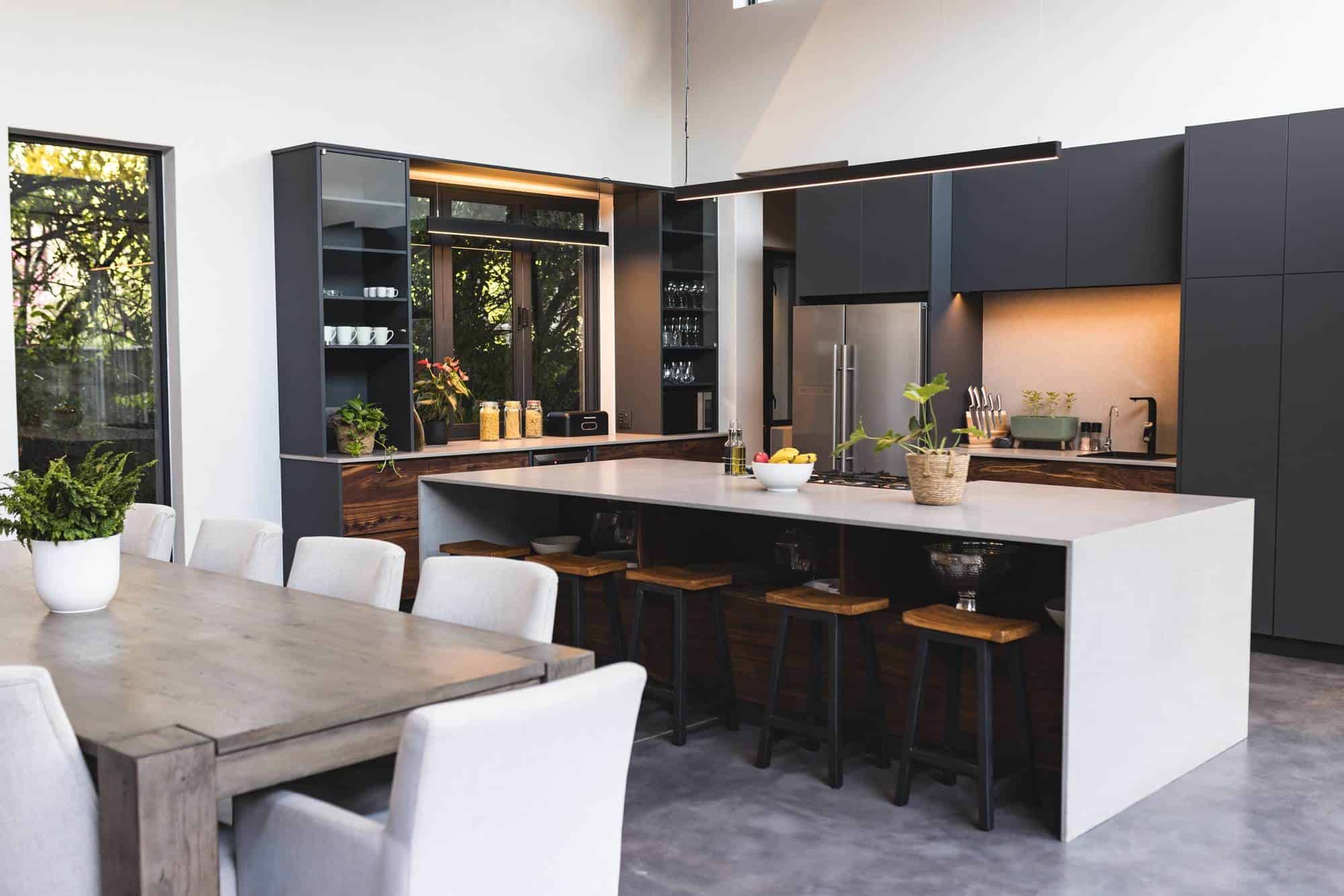 Contemporary kitchen with custom cabinets and a large island for cooking and dining.
