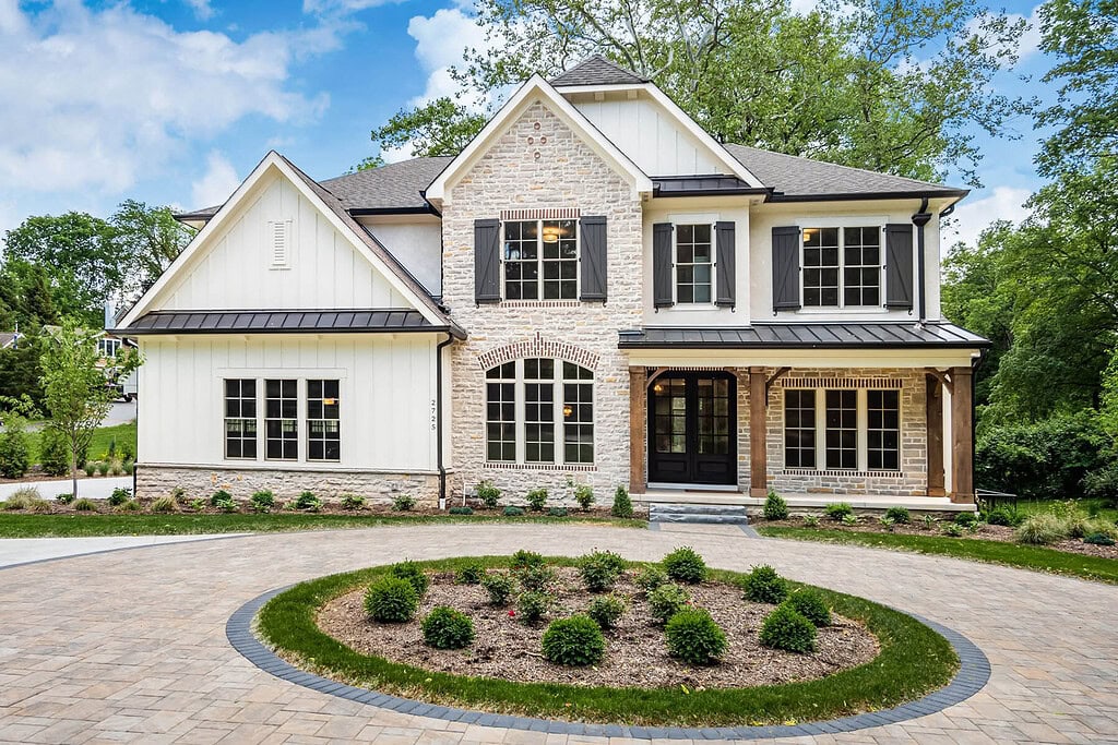 A home by Compass Homes with a circular driveaway.