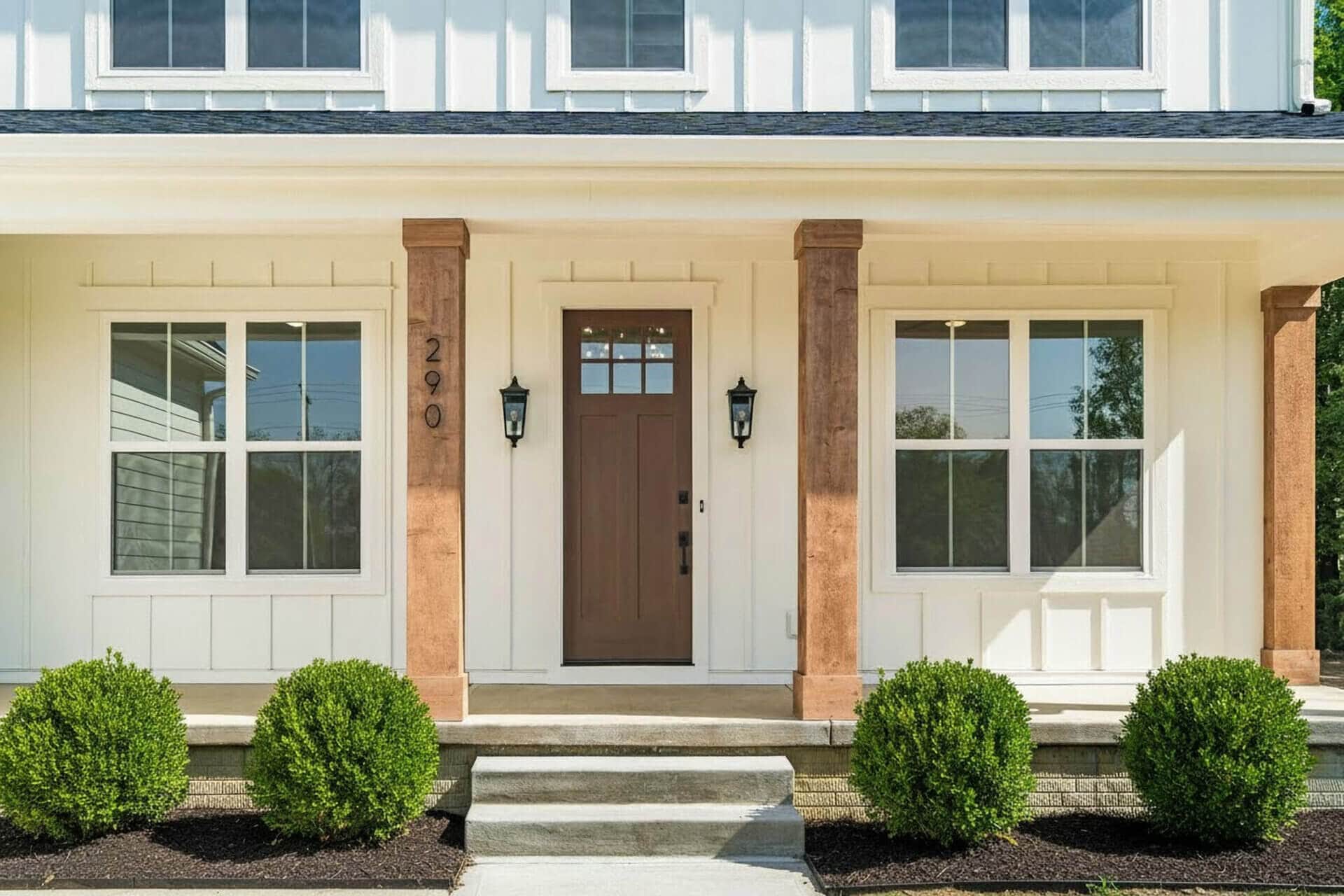 The front door and porch of a custom home by Compass Homes.