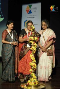 Women lighting a traditional lamp at India Food Safety Conclave 2024.