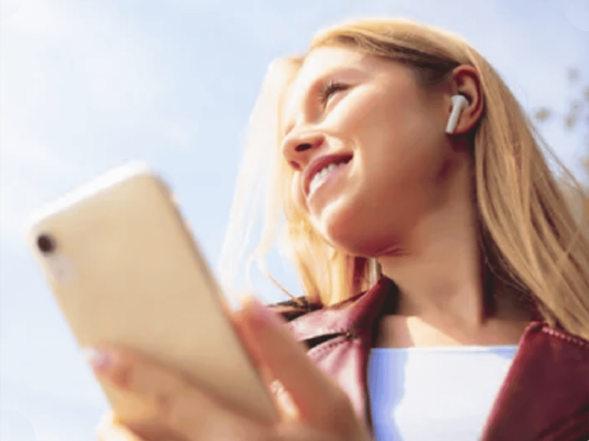 Women with Ear buds and phone