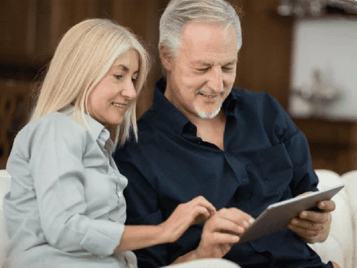 Couple reviewing content on tablet