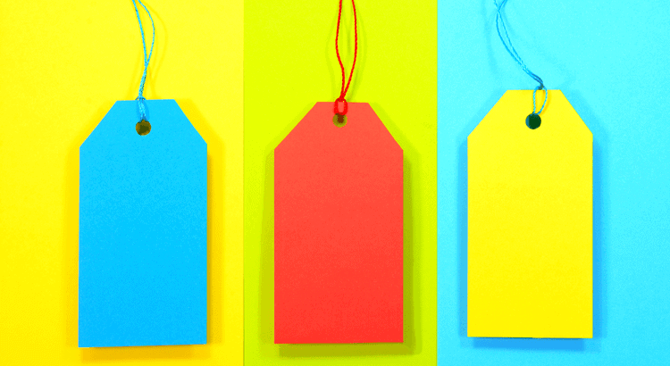 Blue and red price tags on colorful background.